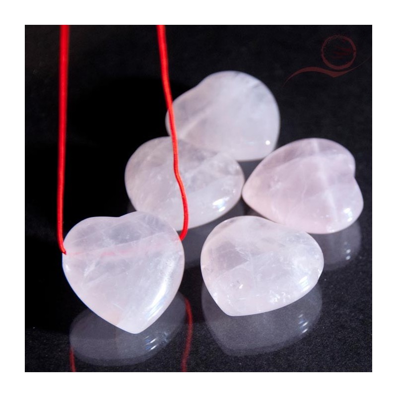 Coeur en quartz rose foré Coeur en quartz rose foré