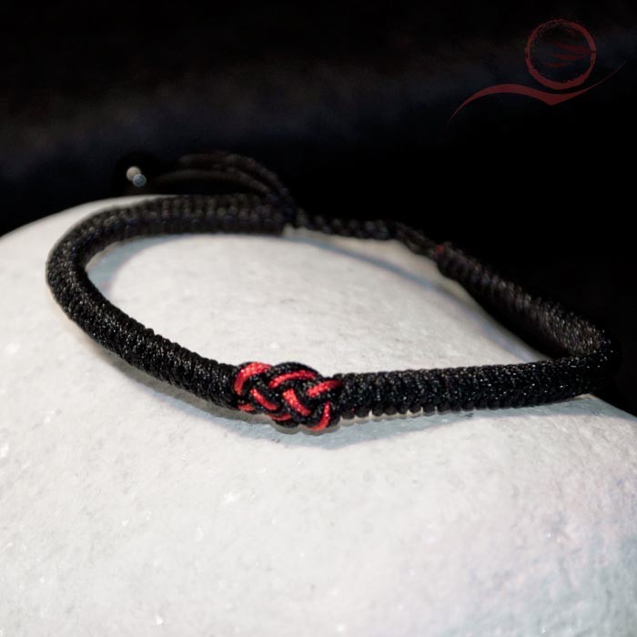 Black thread bracelet and bow Black thread bracelet and bow