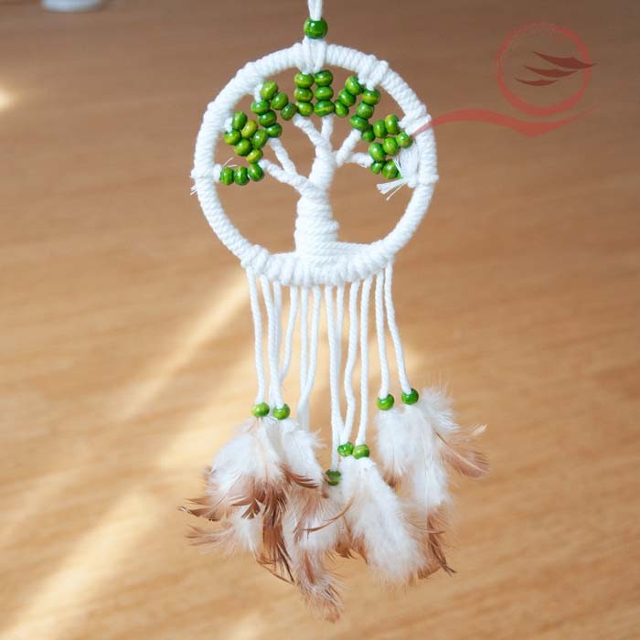 Very beautiful dream catcher with its beautiful tree of life and its wooden beads
